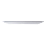 A plain, white, oval-shaped ceramic plate shown in a side view on a white background. The minimalist design is accentuated by its clean profile, reminiscent of the Sierra Collection serving platter’s smooth surface and slightly upturned edges.