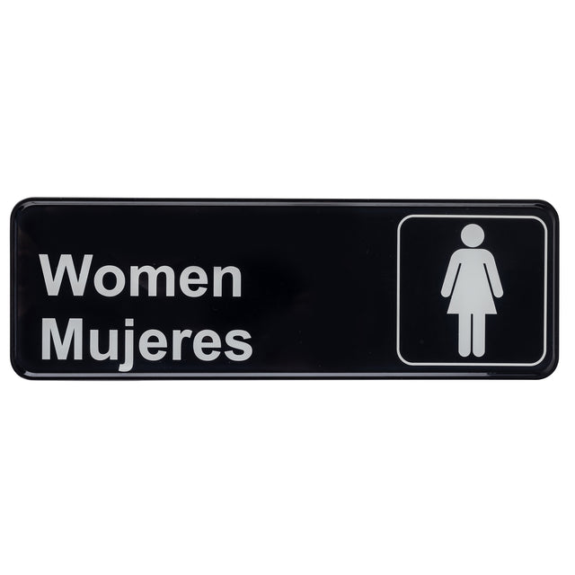 A black rectangular polystyrene women sign with white text reading Women Mujeres and a simple female icon inside a square on the right, indicating a women's restroom in both English and Spanish.