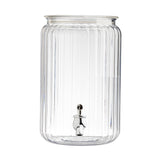 A large, clear 2-gallon beverage dispenser with vertical ribbed lines, a wide opening at the top, and a shiny silver spigot at the bottom front for pouring drinks. The acrylic dispenser is empty and shown against a white background.