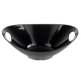 A glossy black Frostone Collection serving bowl with a wide, shallow shape and two large oval handles. Crafted from durable melamine, this modern bowl has a smooth, reflective surface and is dishwasher safe for easy cleaning.