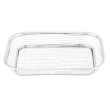 The TableCraft Grande Basket is a rectangular, shallow wire basket crafted from shiny, polished stainless steel with a grid pattern and rounded corners. The empty basket is photographed against a white background.