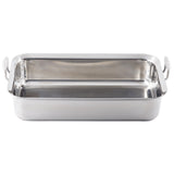 A rectangular Tri-Ply Serving Pan with rounded corners and two sturdy, circular side handles. This stainless steel serving pan boasts a smooth, reflective finish and is shown on a plain white background.