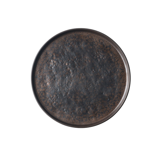 A round, dark ceramic plate from the Lunara Collection platter, viewed from above. The plate has a slightly raised rim and a textured, mottled surface in shades of dark brown and black, giving it a rustic, handcrafted appearance against a plain white background.