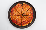 A whole cheese pizza, sliced into eight even pieces, sits on a dark Lunara Collection platter by TableCraft Products against a plain white background. The pizza has a golden-brown crust, visible tomato sauce, and melted, lightly browned cheese on top.