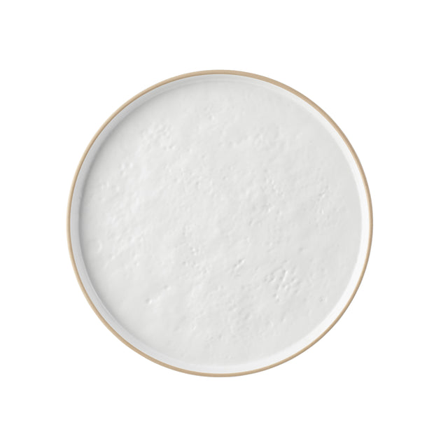 A round, shallow melamine bowl filled with a thick, white, creamy substance, resembling yogurt or sour cream, viewed from above against a plain white background. The smooth surface shows subtle bubbles and texture; the bowl is dishwasher safe.