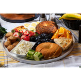 A breakfast platter featuring bagels, fruit, muffins, eggs, herbed cheese spread, and quiche is beautifully arranged on a Europa Collection Serving Tray—a stylish melamine serving tray that’s both elegant and dishwasher safe.