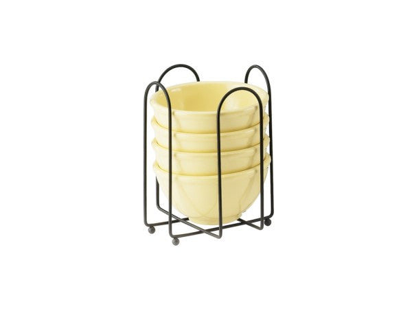 Four light yellow ceramic bowls are stacked neatly in a black wire frame bowl holder with curved handles and four small round feet, all set against a plain white background. The BPA free rack is designed to securely hold and organize the bowls.