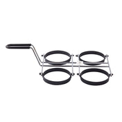 A metal kitchen tool with a black handle and four round, non-stick egg rings arranged in a square, connected by metal bars. It’s designed for cooking perfectly round eggs or pancakes on a stovetop and is dishwasher safe.