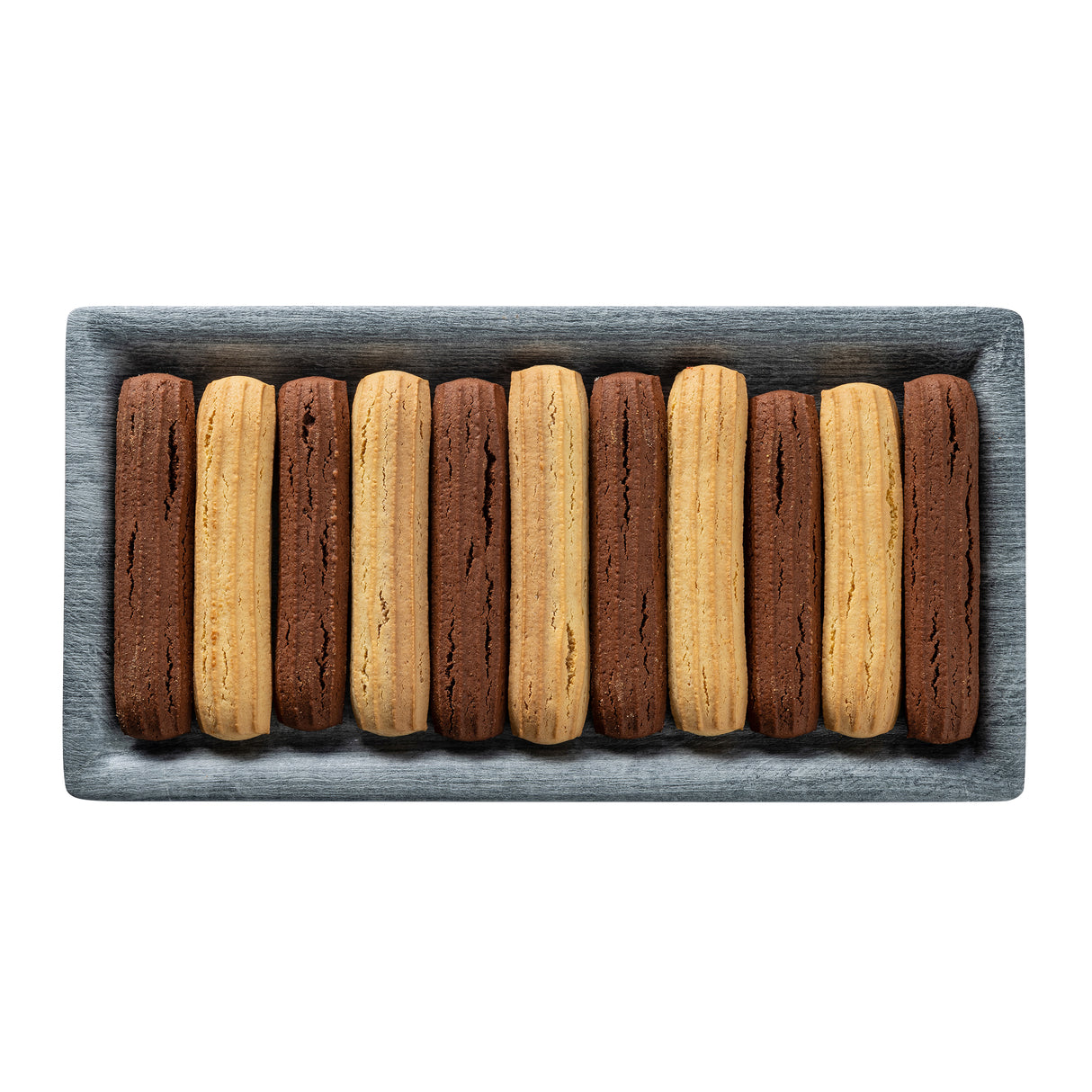A rectangular melamine tray holds twelve long, ridged cookies, arranged in alternating rows of golden brown and chocolate brown, neatly lined up in parallel on a white background. Perfect for serving on TableCraft Products.