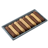 A rectangular melamine tray from TableCraft Products holds ten long sandwich biscuits in alternating rows of chocolate and vanilla, each with a ridged surface and cream filling peeking between the layers.