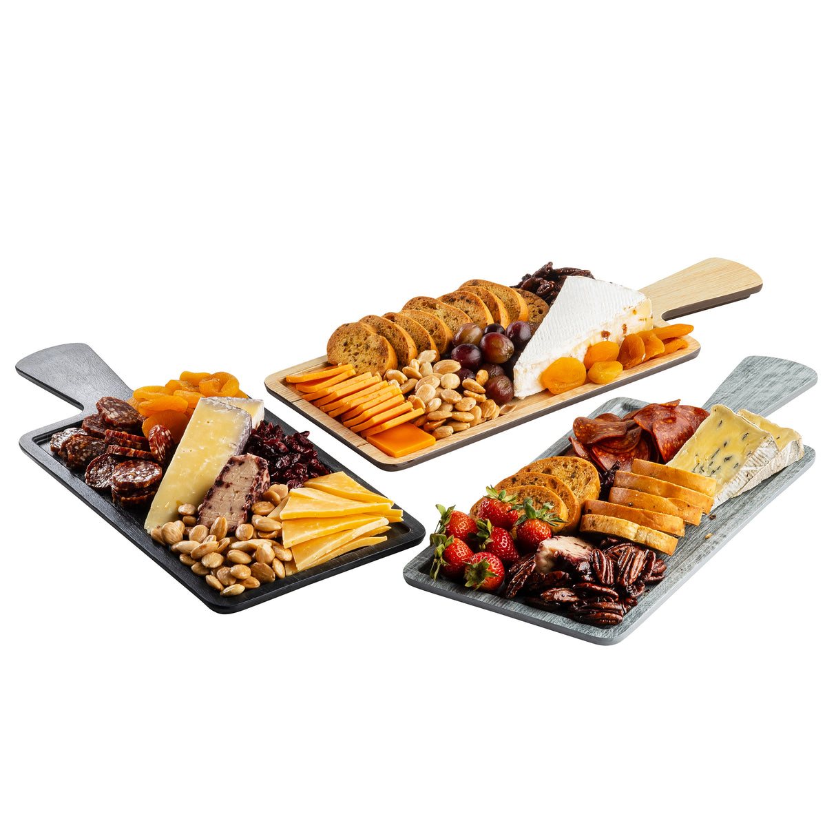 Three charcuterie boards are arranged with assorted cheeses, cured meats, nuts, and fruits. Each features a variety of textures and colors, artfully presented on wooden Serving Paddles and trays from the Onyx Melamine Collection.