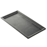 A rectangular black tray with slightly raised edges and a smooth, matte surface, the TableCraft 12457 Onyx Melamine Serving Tray is shown from a slight angle against a white background.