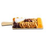 A TableCraft Products Timber Melamine Serving Paddle displays sliced baguette, cheddar cheese, brie, red grapes, pecans, dried apricots, and almonds neatly arranged on a white background.