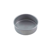 A plain, empty, round cake pan with short sides is shown against a white background. The pan features a smooth, non-stick surface and has no handles or visible markings.
