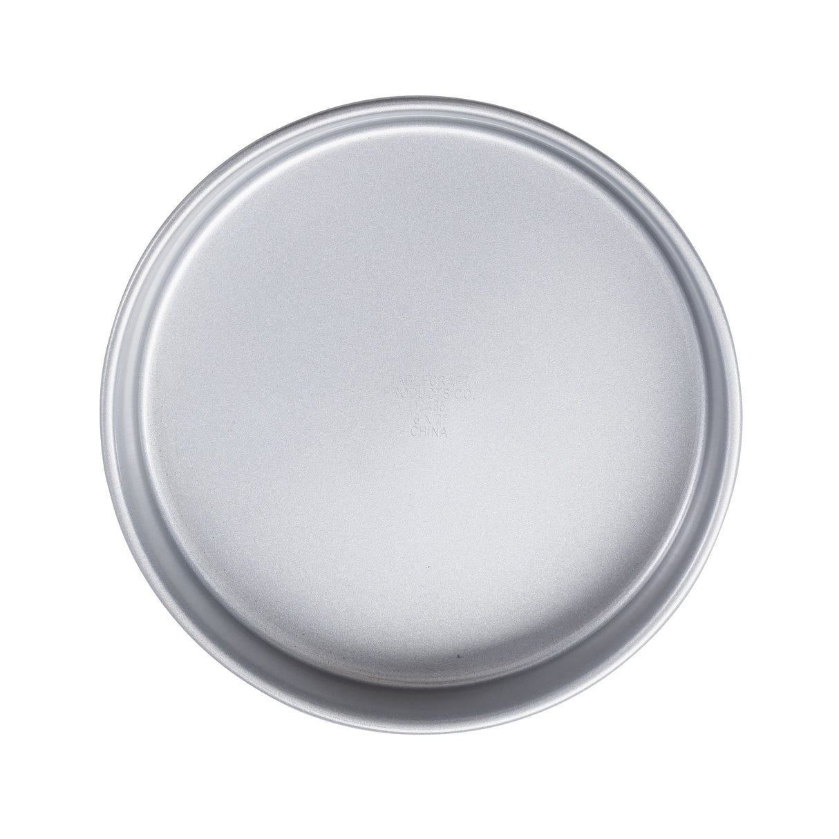 A round, silver non-stick cake pan with smooth edges and a flat bottom is shown from above on a white background. The round steel pan has a simple, untextured surface and appears clean and unused.