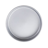 A round, silver non-stick cake pan with smooth edges and a flat bottom is shown from above on a white background. The round steel pan has a simple, untextured surface and appears clean and unused.