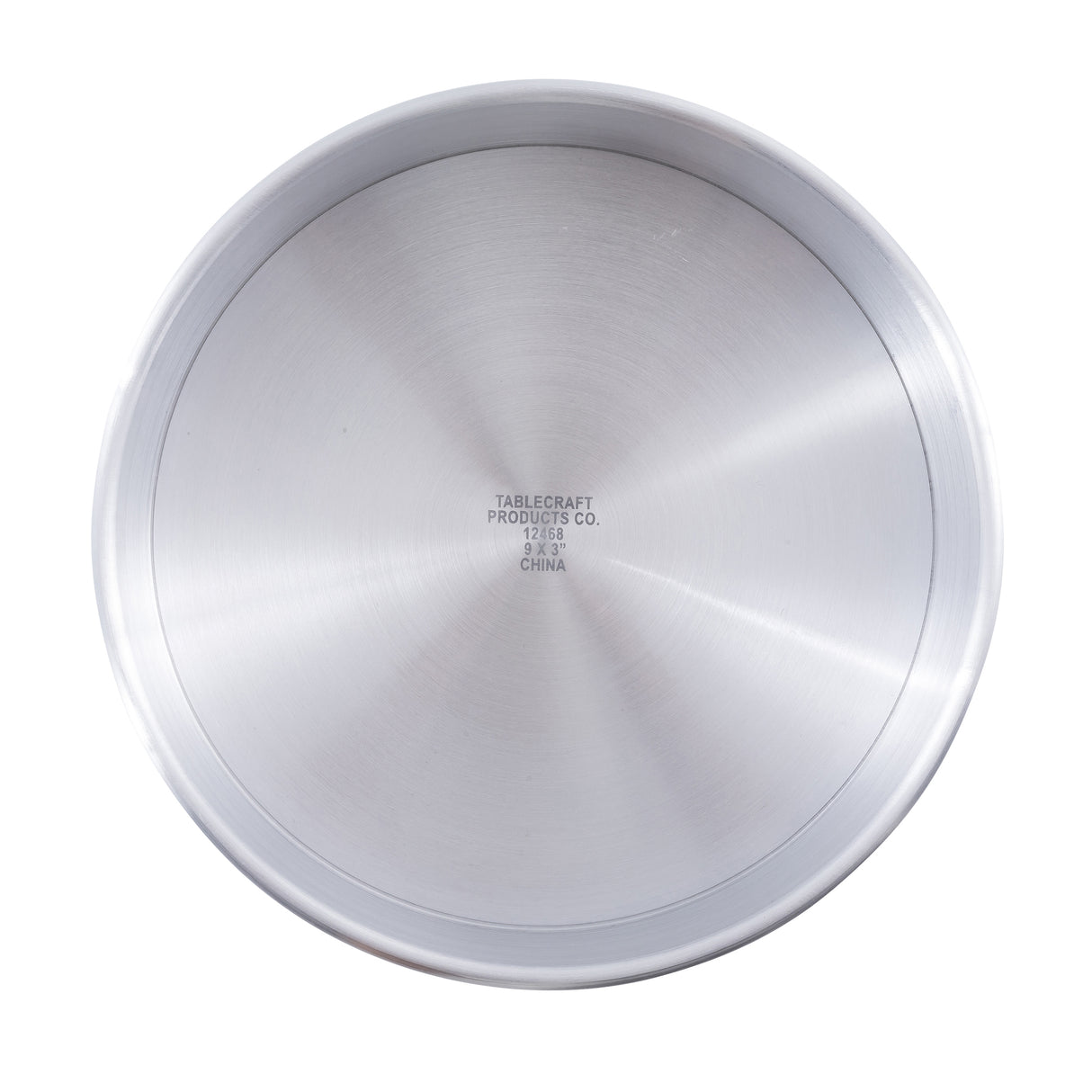 A round aluminum pan with smooth sides and a brushed metal interior. At the center of the base, black text reads: “TABLECRAFT PRODUCTS CO. 21363 9 x 2 3/4 CHINA.” This cheesecake pan is empty and photographed from above.