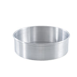 A round aluminum pan, like the TableCraft 12468 cheesecake pan, with smooth sides and a flat base is shown on a white background. This silver-colored metal pan features a simple, reflective finish and has no handles or decorations.
