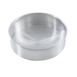 A round, shallow, silver-colored TableCraft cheesecake pan with smooth sides and a flat base is shown on a white background. The pan appears empty and is made from brushed aluminum.
