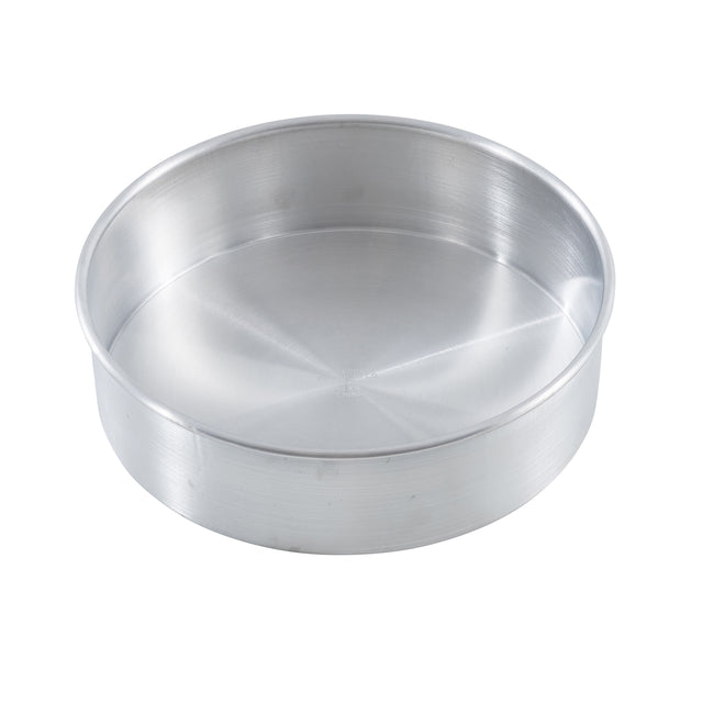 A round, shallow, silver-colored TableCraft cheesecake pan with smooth sides and a flat base is shown on a white background. The pan appears empty and is made from brushed aluminum.