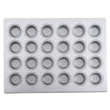 A silver silicone glazed non-stick mini muffin pan with 24 evenly spaced, round cups arranged in a 4 by 6 grid. The smooth, shiny surface and slightly raised edges make it perfect for baking small cupcakes or muffins.