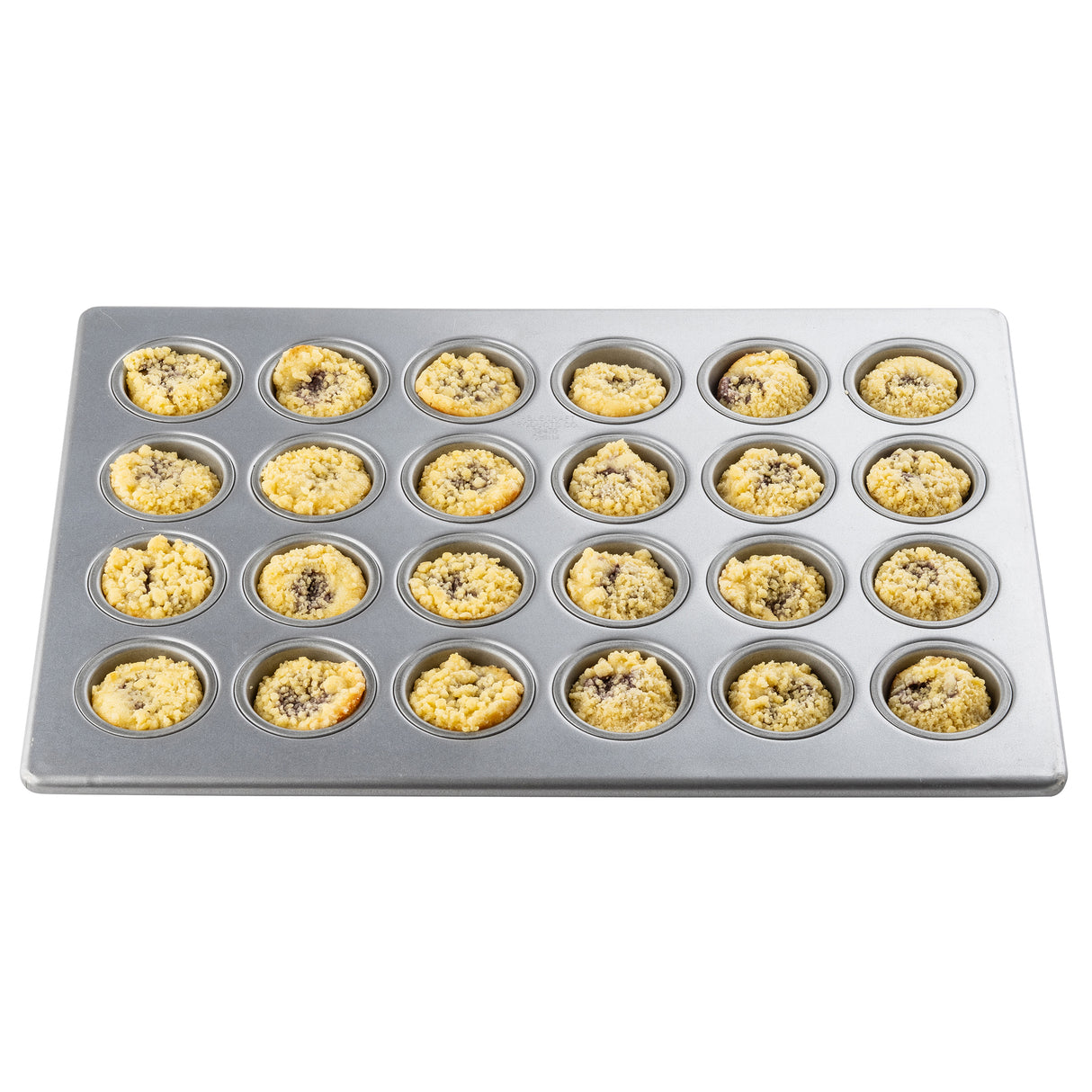 A 24 cup mini muffin pan with a silicone glazed non-stick finish is filled with unbaked crumb-topped muffin batter, visible dark chocolate chips or fruit pieces in each round cavity, isolated on a white background.