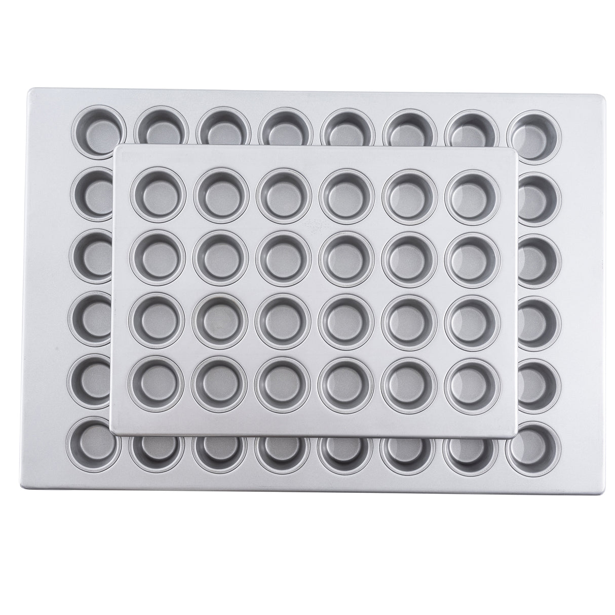 Two rectangular aluminized steel muffin pans with multiple small, round wells are stacked together. The smaller mini muffin pan rests on top at a slight angle, both pans appearing clean and unused.