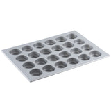 A silver non-stick muffin pan with 24 round cups arranged in a 4 by 6 grid, set on a white background. The tray is angled slightly, highlighting the cup depth and smooth cupcake pan surface.