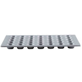 A silver, rectangular non-stick muffin pan with 24 evenly spaced, round cup molds arranged in a 4x6 grid; the pan is viewed from the side, showing the depth of each cup.