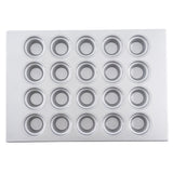 A silver metal muffin or cupcake pan is shown from above, featuring 24 round, evenly spaced cups arranged in a 4 by 6 grid. This silicone glazed non-stick pan has a smooth, shiny finish with slightly raised edges around each cup.