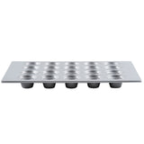 A silver, silicone glazed non-stick 20 cup muffin pan with small, round, evenly spaced cups arranged in a grid. The clean, unused pan is shown from a side angle on a white background—ideal for baking mini muffins or cupcakes.
