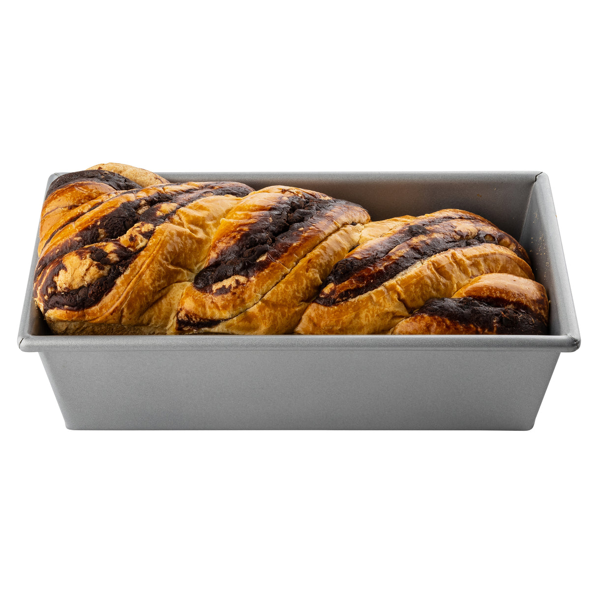 A rectangular aluminized steel bread pan holds a braided bread with a golden-brown crust and dark chocolate swirls on top, resembling a babka. The image is set against a white background.