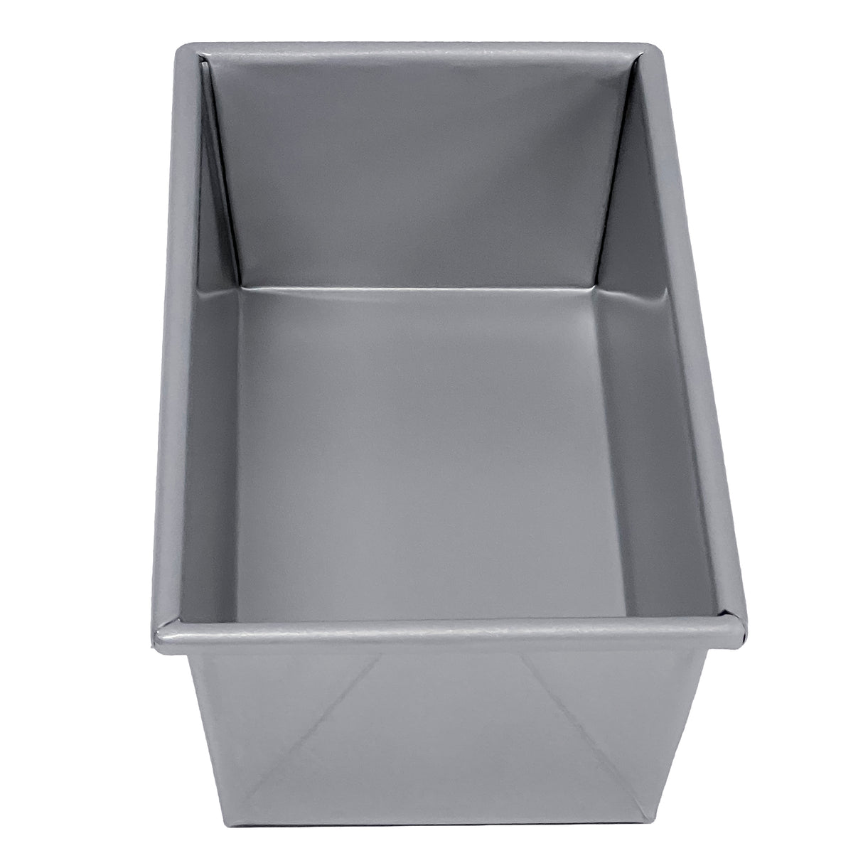 A rectangular, silver aluminized steel bread pan with straight sides and sharp corners, viewed from above at a slight angle. The pan is clean, empty, and has a smooth, reflective surface.