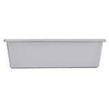 A plain, rectangular aluminized steel bread pan is shown from the side on a white background. The loaf pan has straight sides, a flat base, and a slightly wider top edge that forms a small rim.