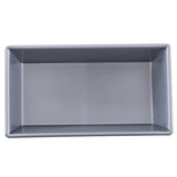 A rectangular, silver aluminized steel bread pan with straight sides and sharp corners, viewed from above on a plain white background. The pan is empty and features a smooth, non-stick interior surface.