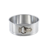 An 8.5 inch springform pan with smooth sides and a shiny, reflective surface features a latch on the side for easy release. This round aluminum pan is shown against a plain white background.