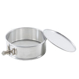 An 8.5 inch springform pan made of stainless steel sits open, with its separate lid resting at an angle beside it. The container features smooth sides and a slightly raised base, ideal for food storage or baking.