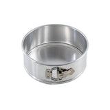 A shiny, round, 8.5 inch aluminum springform pan with a latch on the side. The latch secures the removable side wall to the flat base. The empty pan sits on a white background.