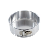 A round, silver-colored 9.5 inch springform pan with smooth sides and a latch closure on the side, used for baking cakes. The aluminum springform pan is empty and shown against a plain white background.