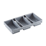 A gray plastic drawer organizer with five rectangular compartments of various sizes, arranged side by side. The sections are separated by raised dividers, ideal for utensils or bread pan accessories made from aluminized steel or non-stick coating. Smooth finish included.