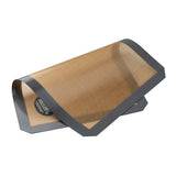 A brown half size silicone baking mat with a black border, partially rolled over itself. The mat is labeled “matbakhio” in white text and designed for nonstick baking or roasting, featuring a flexible, reusable structure.