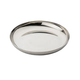 A shiny, round TableCraft 12511 stainless steel plate with slightly raised edges is photographed on a white background. The smooth, reflective surface gives the plate a sleek, modern appearance.