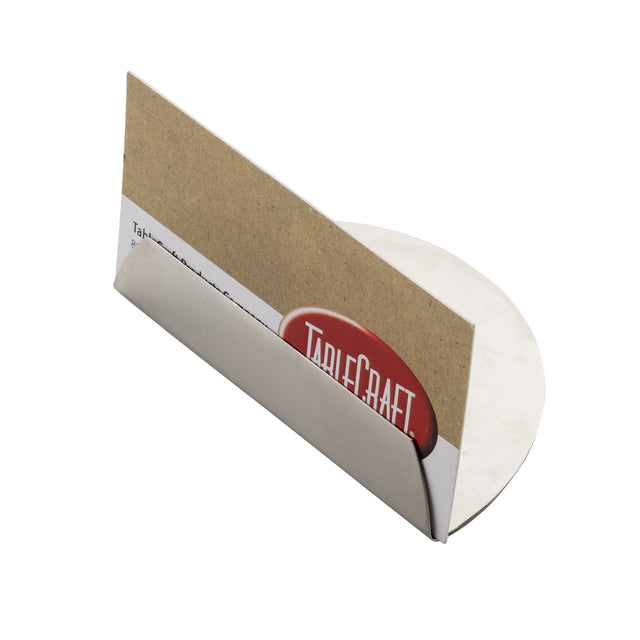 A stainless steel card holder with a flat circular base holds a cardboard sign and a business card featuring the red and white TableCraft logo. The holder is photographed on a white background.