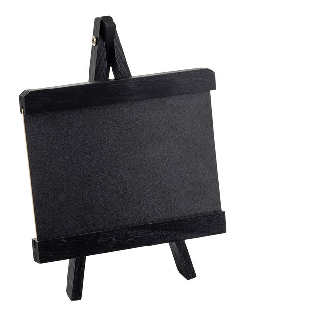 A small black chalkboard sits on a matching miniature wooden easel, both framed with thick black borders. This TableCraft tabletop board sign is empty and tilted slightly to the right, set against a plain white background.