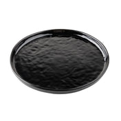 A round, flat black melamine serving plate with a glossy, slightly rippled surface and a smooth, raised edge. The plate sits on a white background, and its reflective finish highlights the textured pattern.