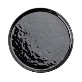 A black, round Ridge Collection Serving Plate with a glossy, slightly textured surface. Photographed from above on a white background, the plate highlights its smooth edges and subtle indentations across the surface.