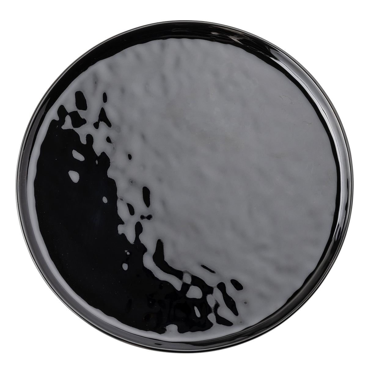 A round, glossy TableCraft black melamine plate from the Ridge Collection, with a slightly wavy, textured surface. Light reflects across the plate, creating irregular highlights and depth. The image is shot top-down against a white background.