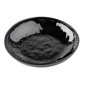 A glossy, round, black TableCraft serving bowl with a slightly uneven, wavy rim and a textured surface. The melamine bowl is empty and photographed from an overhead angle on a white background.