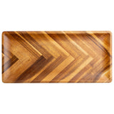A rectangular acacia serving plate from the TableCraft Acacia Collection, featuring rounded corners, a polished finish, and a chevron pattern of alternating light and dark wood grains. The tray is empty and viewed from above against a white background.