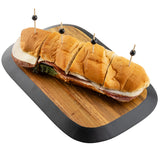 A sub sandwich with deli meats, cheese, and lettuce is sliced into four pieces and secured with toothpicks. It's served on a rectangular serving board from the TableCraft Acacia Collection, set against a clean white background.